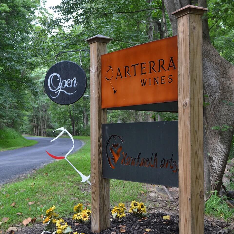 Visiting Arterra Wines, Welcome, Visit, sign located at the entrance of the drive